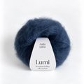 A ball of Auda Yarns Lumi premium Italian silk roving in a deep navy blue color, with a white paper label wrapped around the center, set against a clean white background.