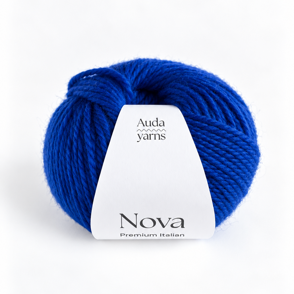 A single ball of vibrant royal blue yarn with a white paper label that reads 'Auda yarns Nova Premium Italian', set against a clean white background.