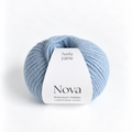 A light blue ball of yarn with a white paper label reading 'Auda yarns Nova Premium Italian cashmere wool' on a clean white background.