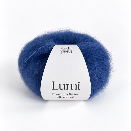 A single ball of blue yarn with a white paper label reading 'Aurora Xarnis Lumi Premium Italian silk mohair' on a clean white background.
